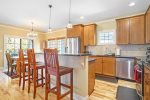 The kitchen includes a dine-in island with a lovely granite top.